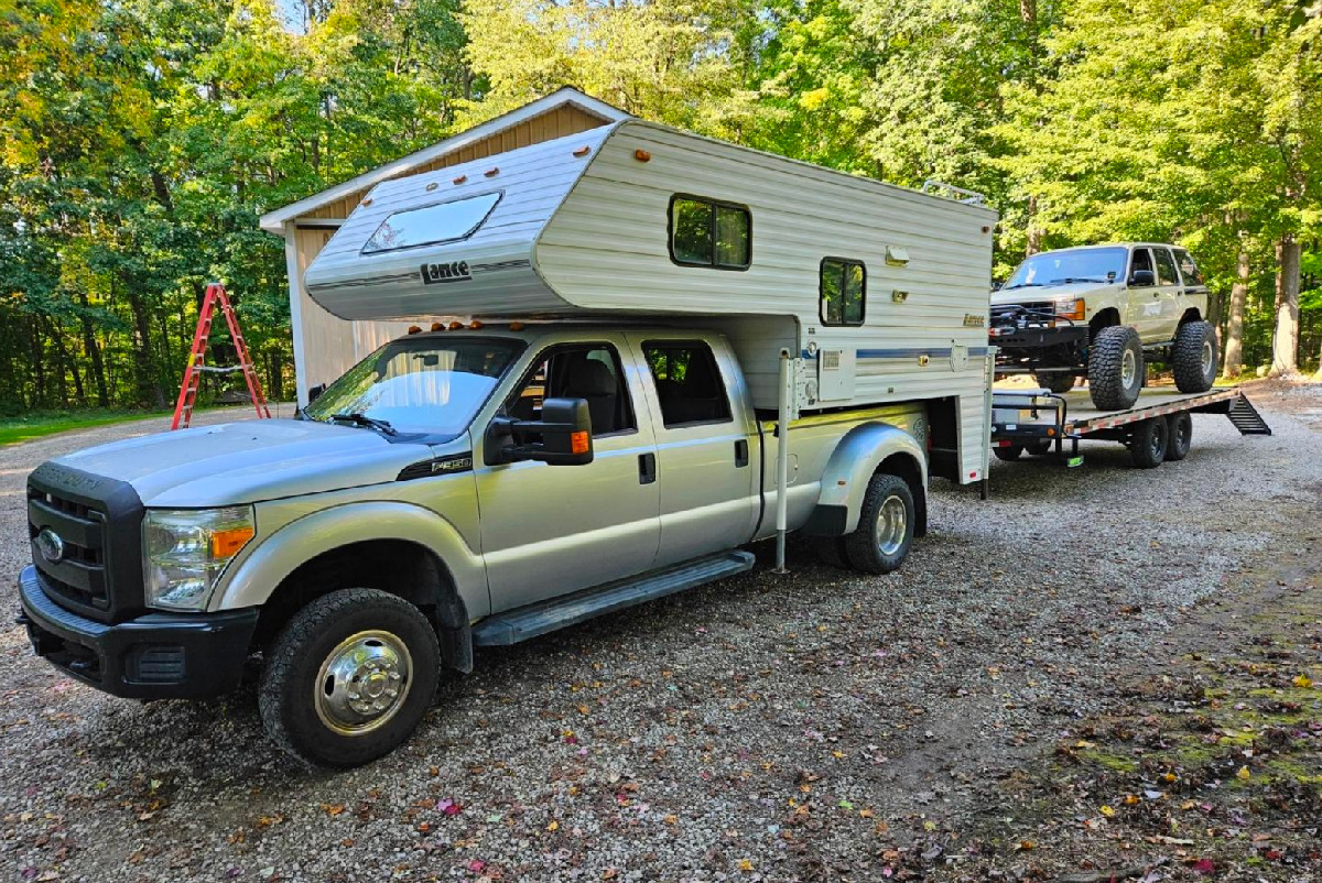 The SuperHitch Magnum in action, hooked to a Ford truck carrying a camper and towing a trailer