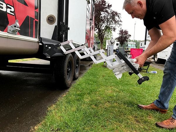 Deploy steps by pulling on the bottom step. Requires as little as six inches of clearance on the side of the RV from any nearby object or obstruction to deploy the steps. 