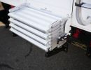 Mounts to the truck camper bumper.